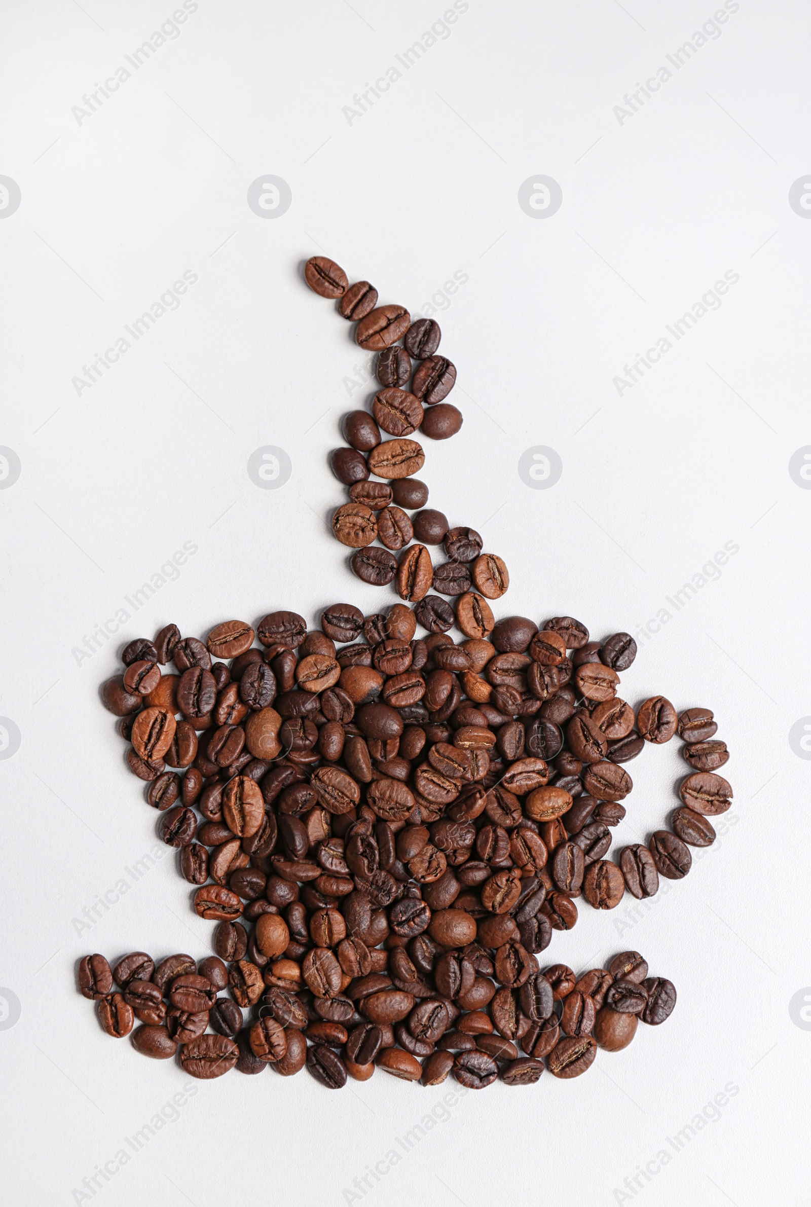 Photo of Cup made of roasted coffee beans on white background