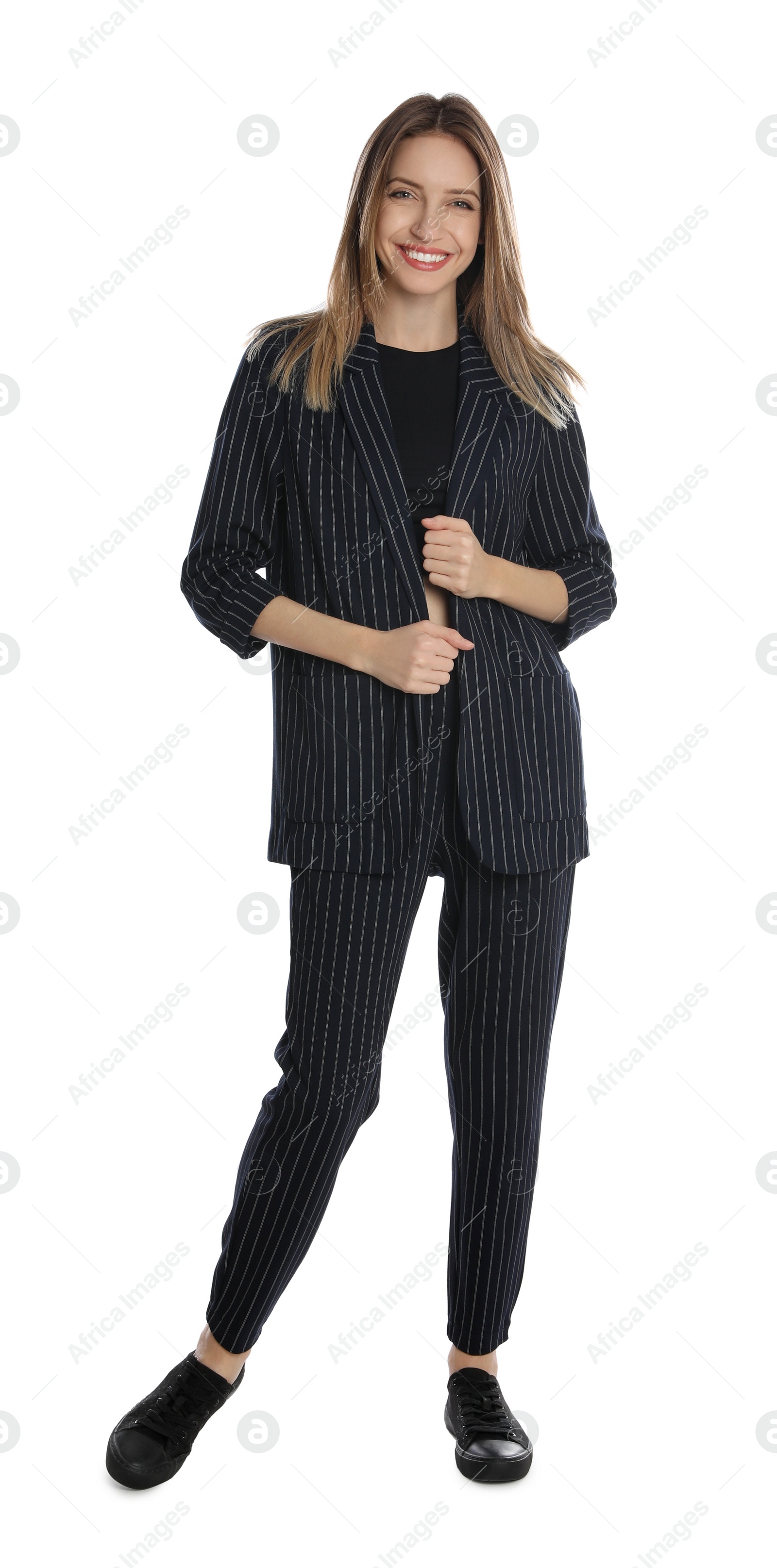 Photo of Full length portrait of beautiful young woman in fashionable suit on white background. Business attire