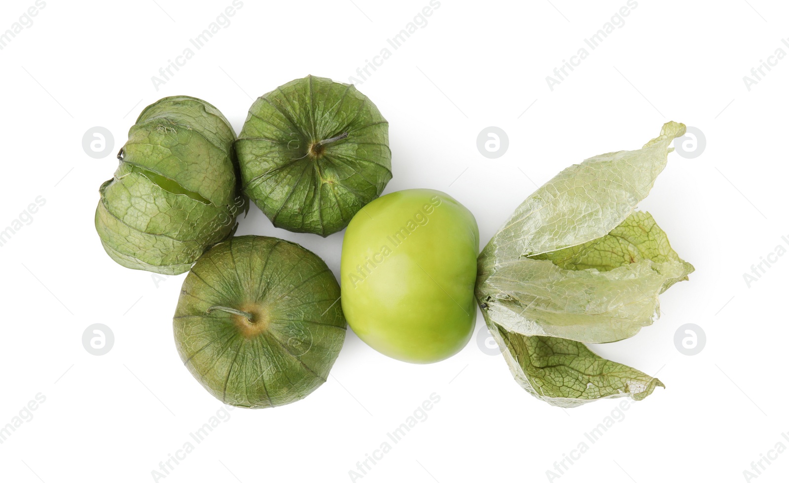 Photo of Fresh green tomatillos with husk isolated on white, top view