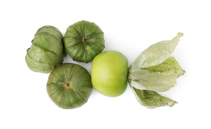 Photo of Fresh green tomatillos with husk isolated on white, top view