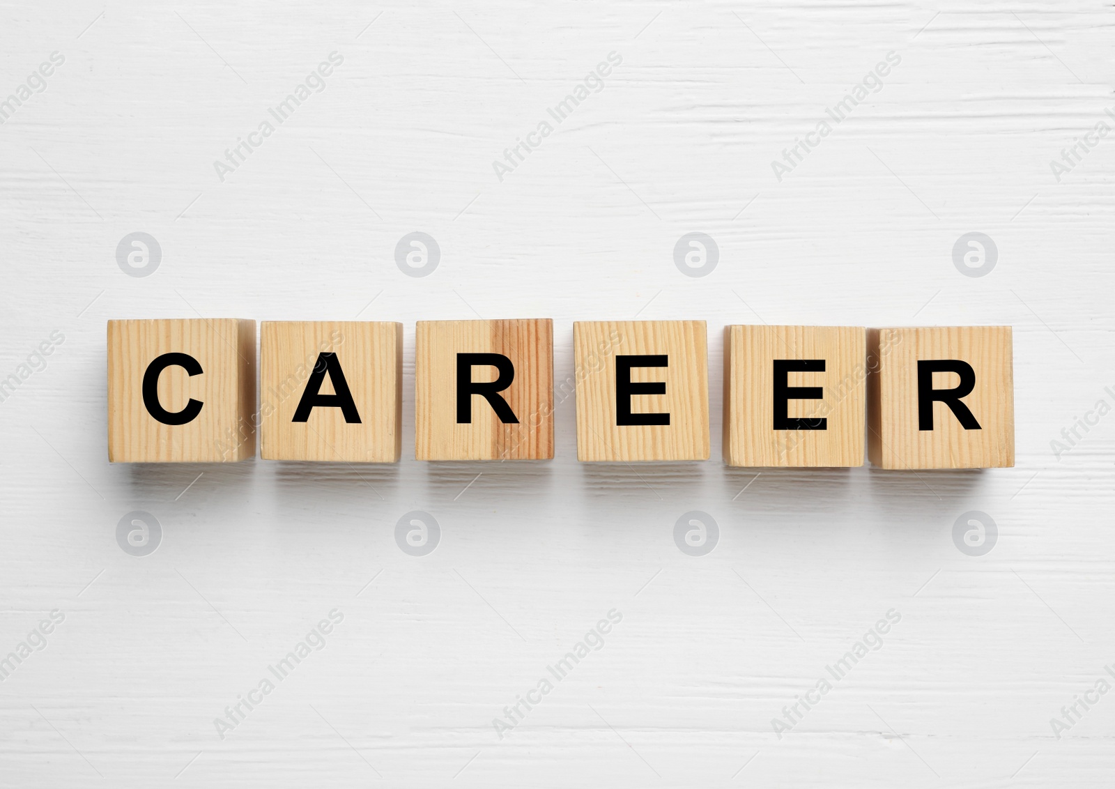 Photo of Cubes with word CAREER on white wooden background, flat lay