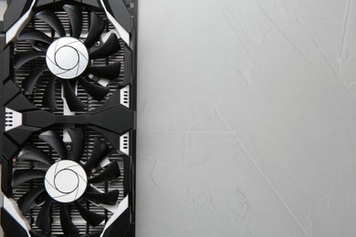 Photo of Computer graphics card on gray textured background, top view. Space for text