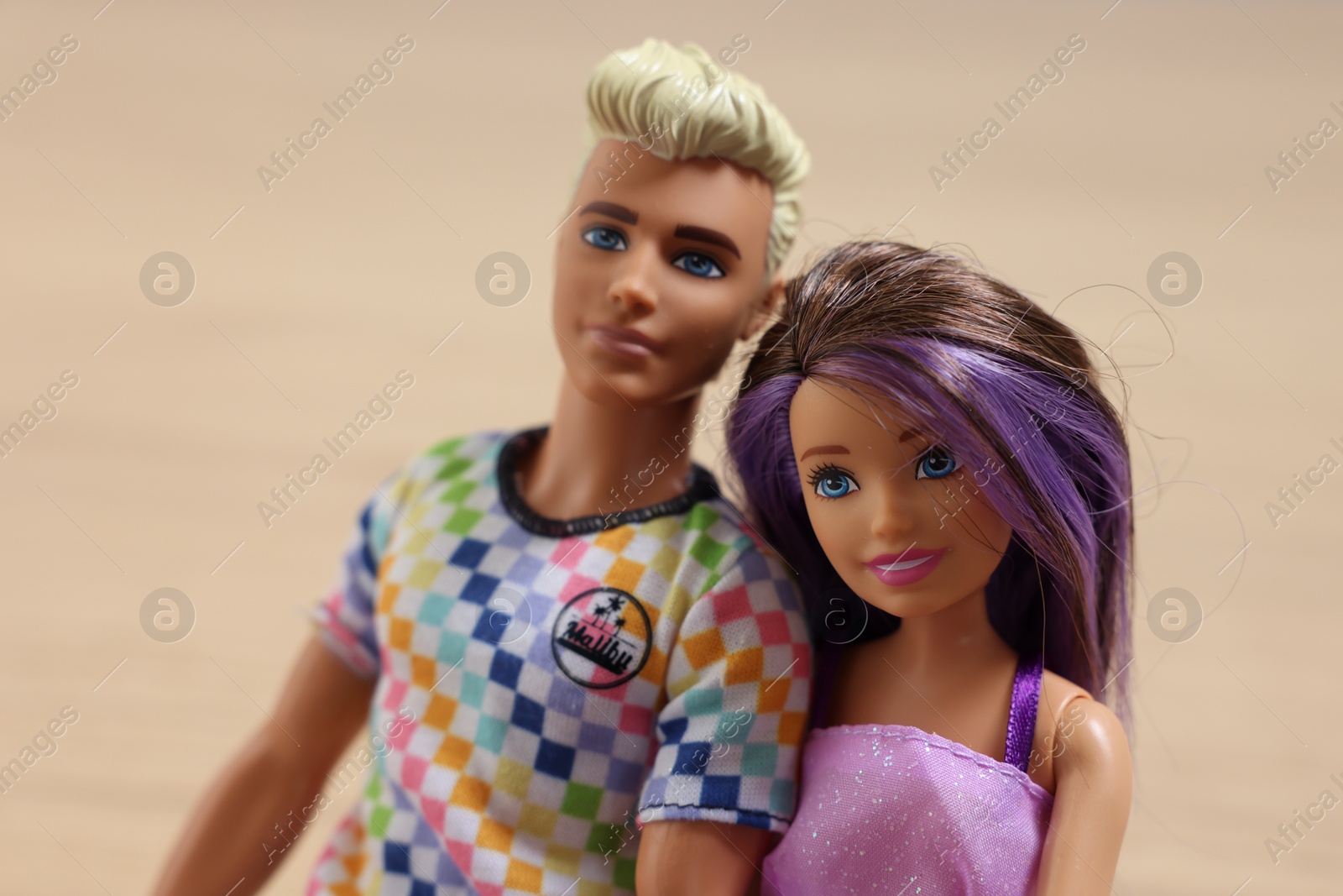 Photo of Leiden, Netherlands - September 20, 2023: Stylish Barbie and Ken dolls on beige background