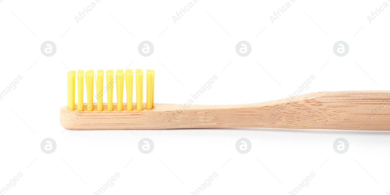 Photo of Bamboo toothbrush on white background. Dental care