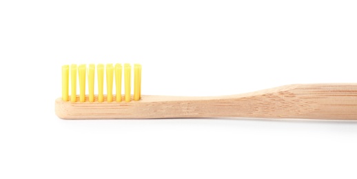 Photo of Bamboo toothbrush on white background. Dental care