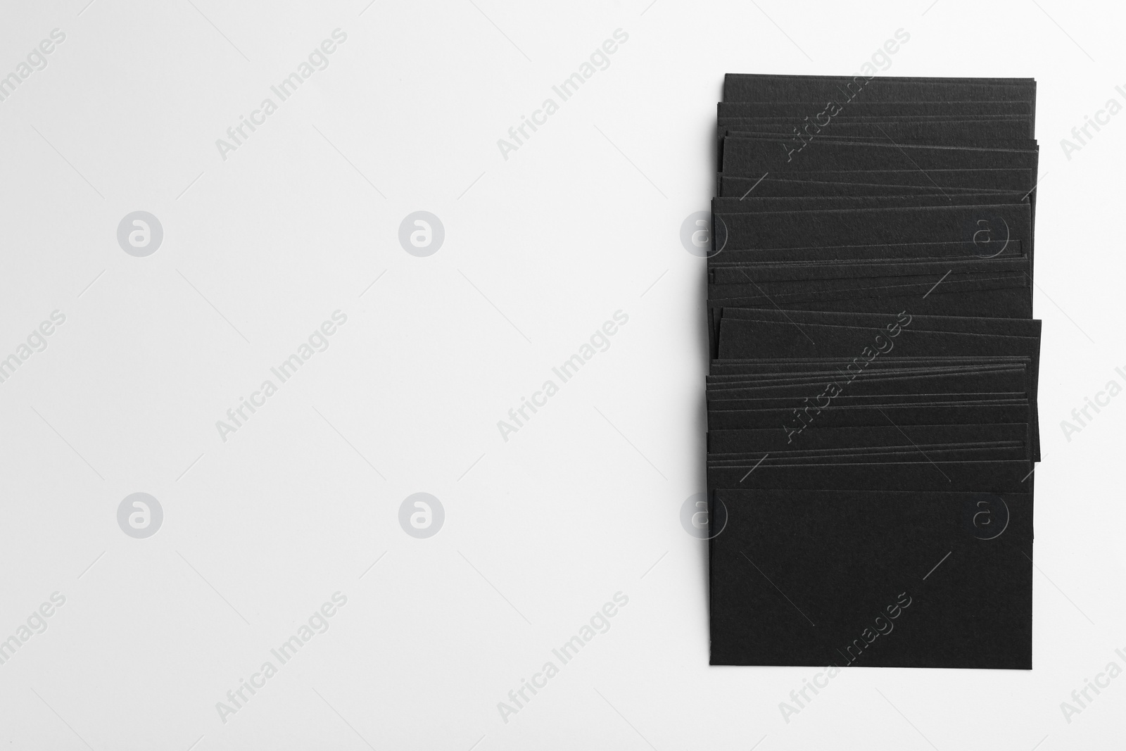 Photo of Blank black business cards on white background, top view. Mockup for design