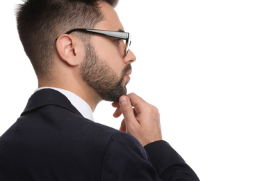 Young businessman with glasses on white background