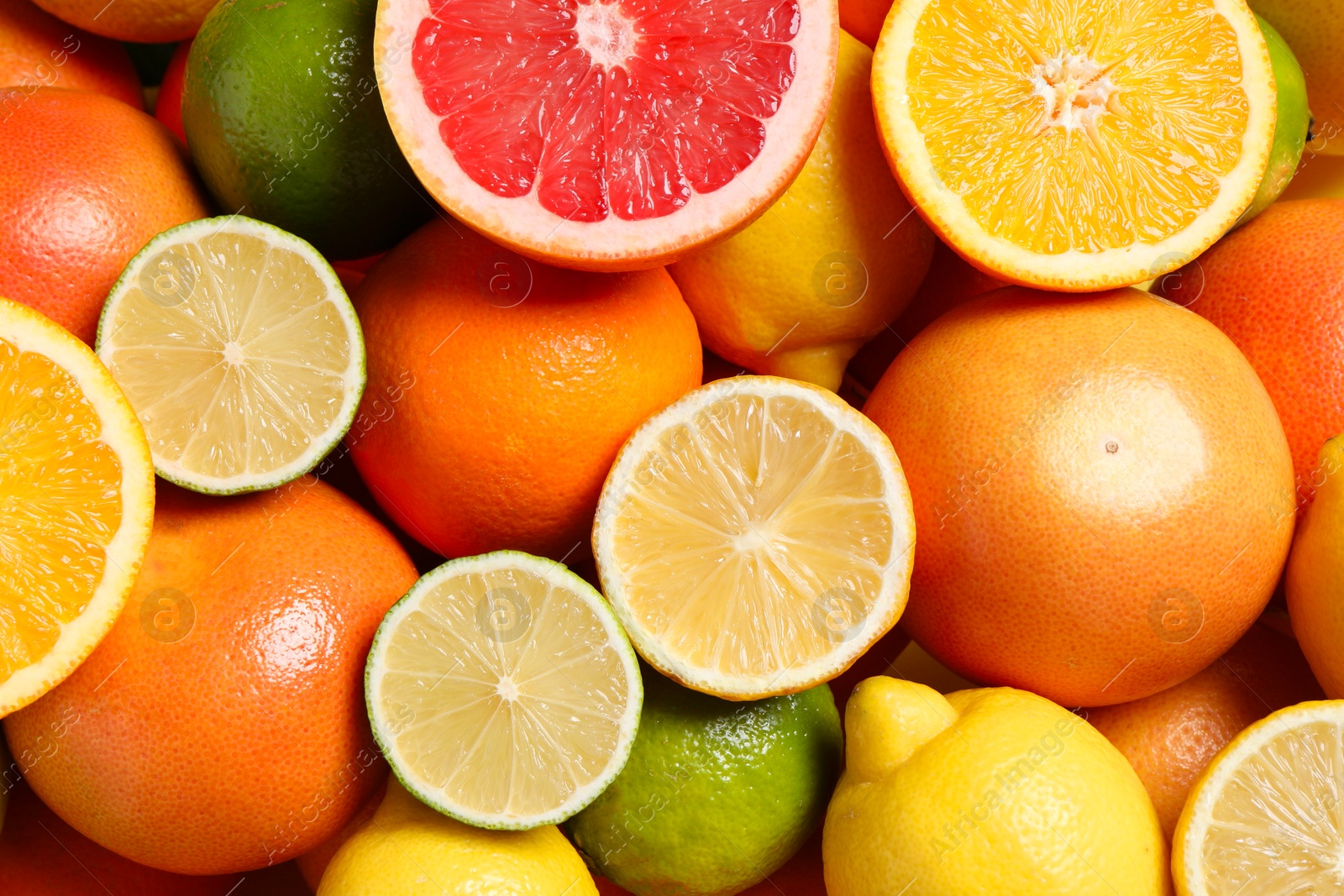 Photo of Different fresh citrus fruits as background, top view