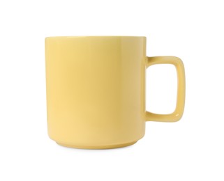 Photo of One yellow ceramic mug isolated on white