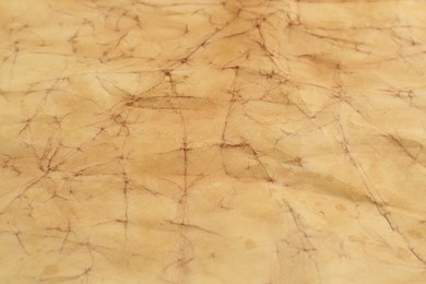 Photo of Sheet of parchment paper as background, closeup