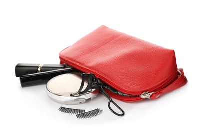 Photo of Cosmetic bag with eyelash curler and makeup products on white background