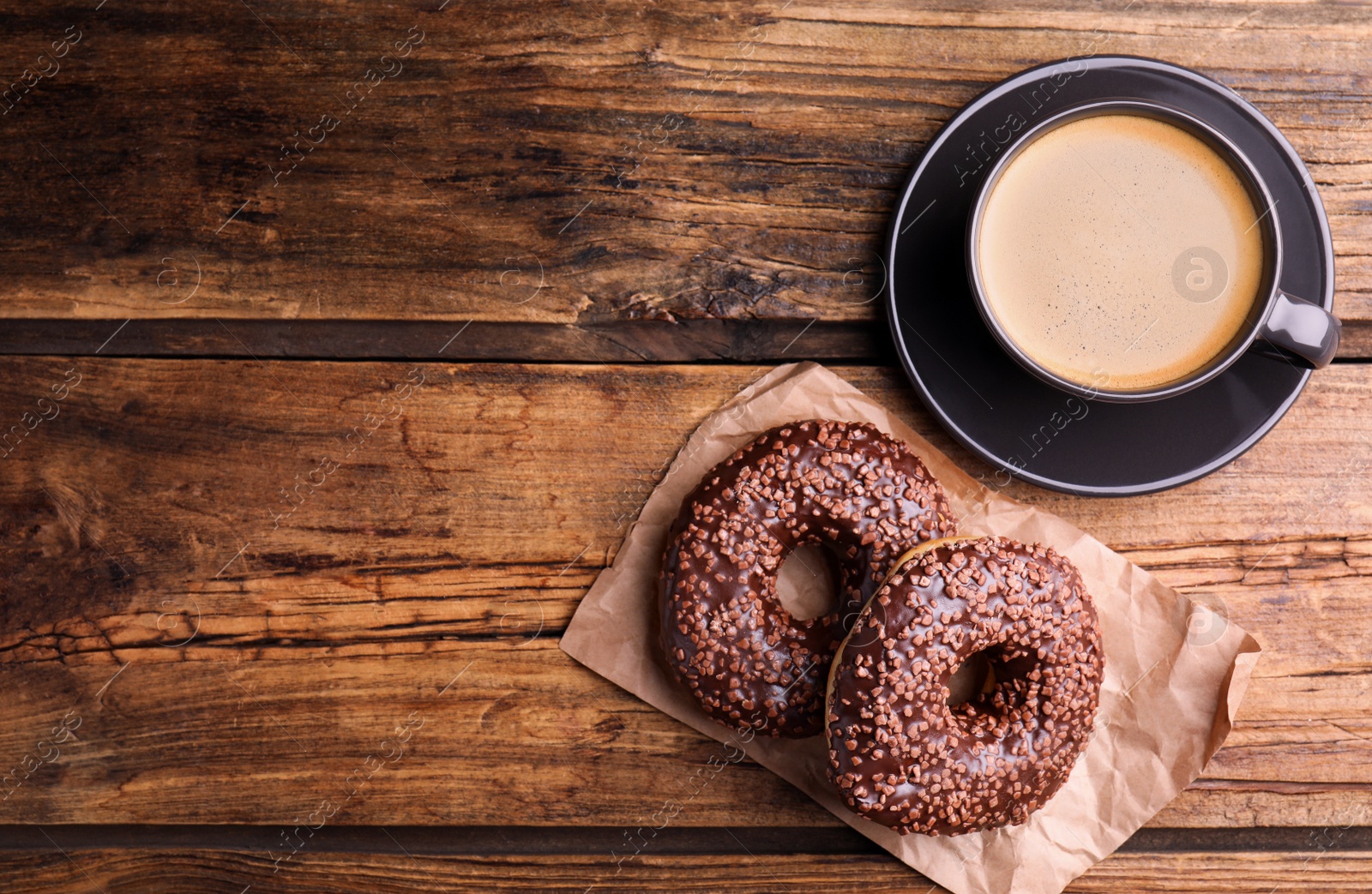 Photo of Delicious pastries and coffee on wooden table, flat lay. Space for text