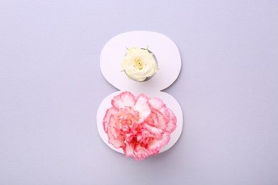 Photo of Paper number 8 and beautiful flowers on light grey background, top view