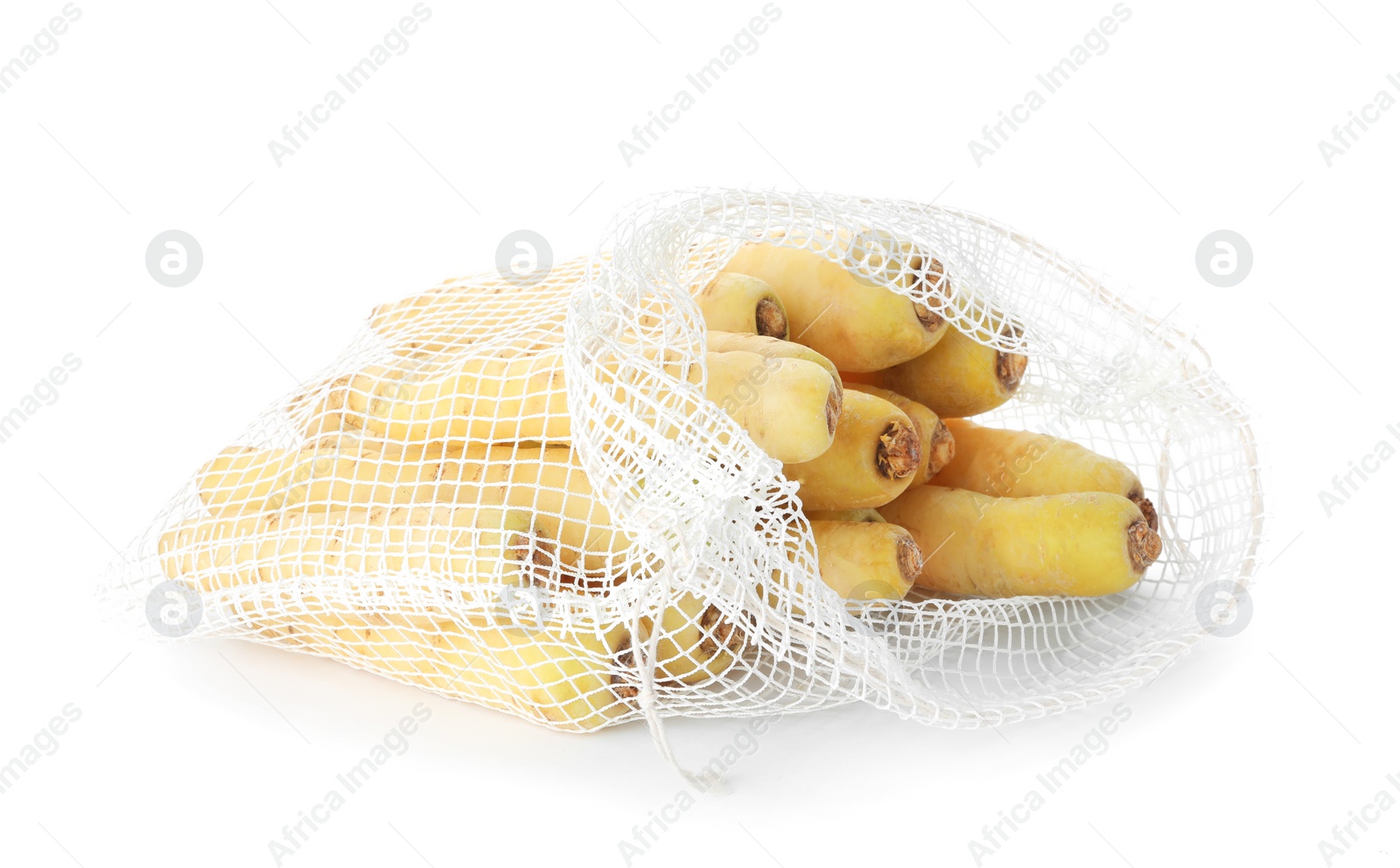 Photo of Raw carrots in mesh bag isolated on white