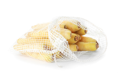 Raw carrots in mesh bag isolated on white