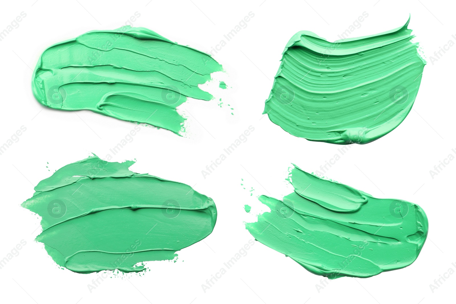 Image of Light green oil paint strokes isolated on white, top view