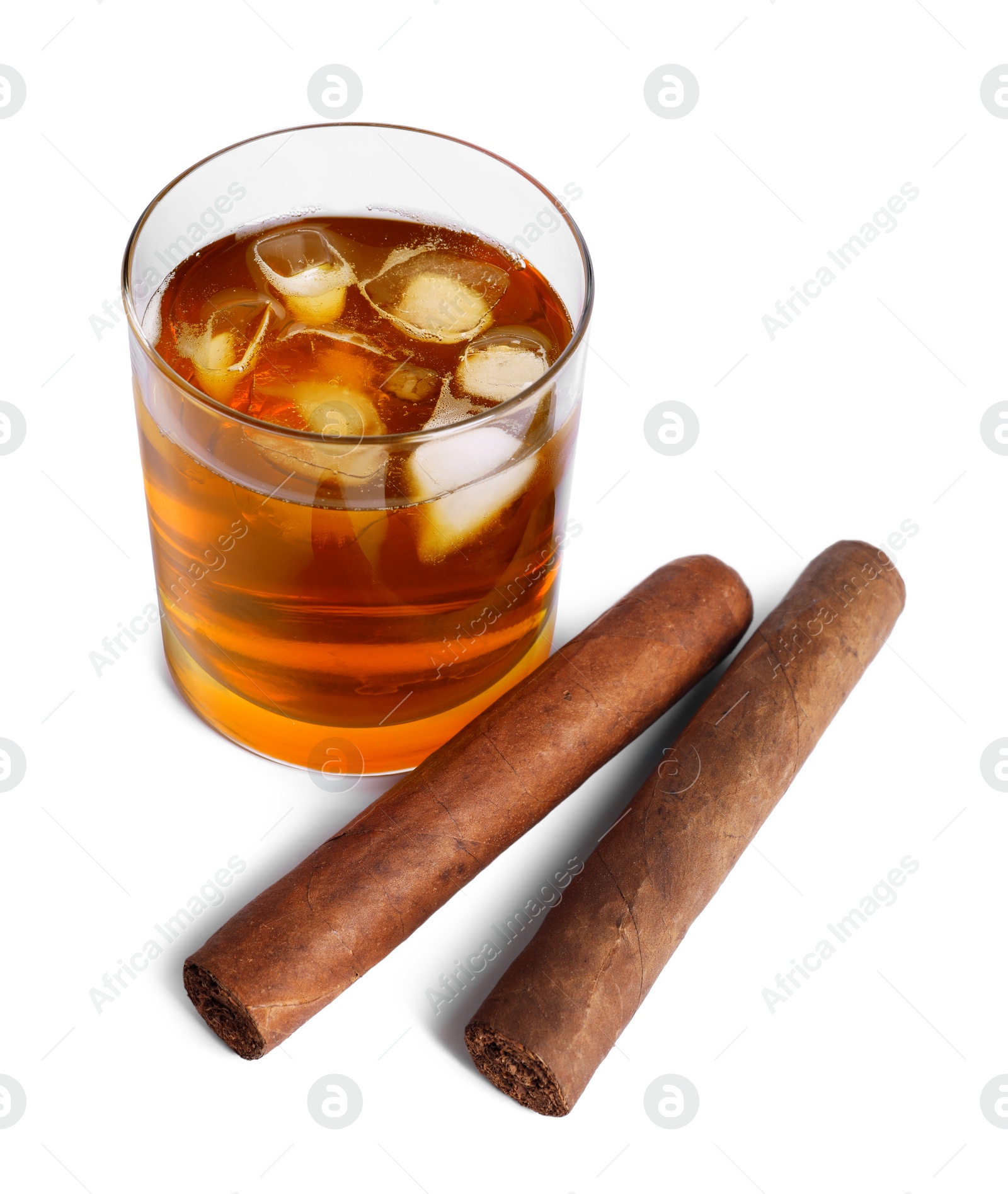 Photo of Glass of whiskey and cigars isolated on white