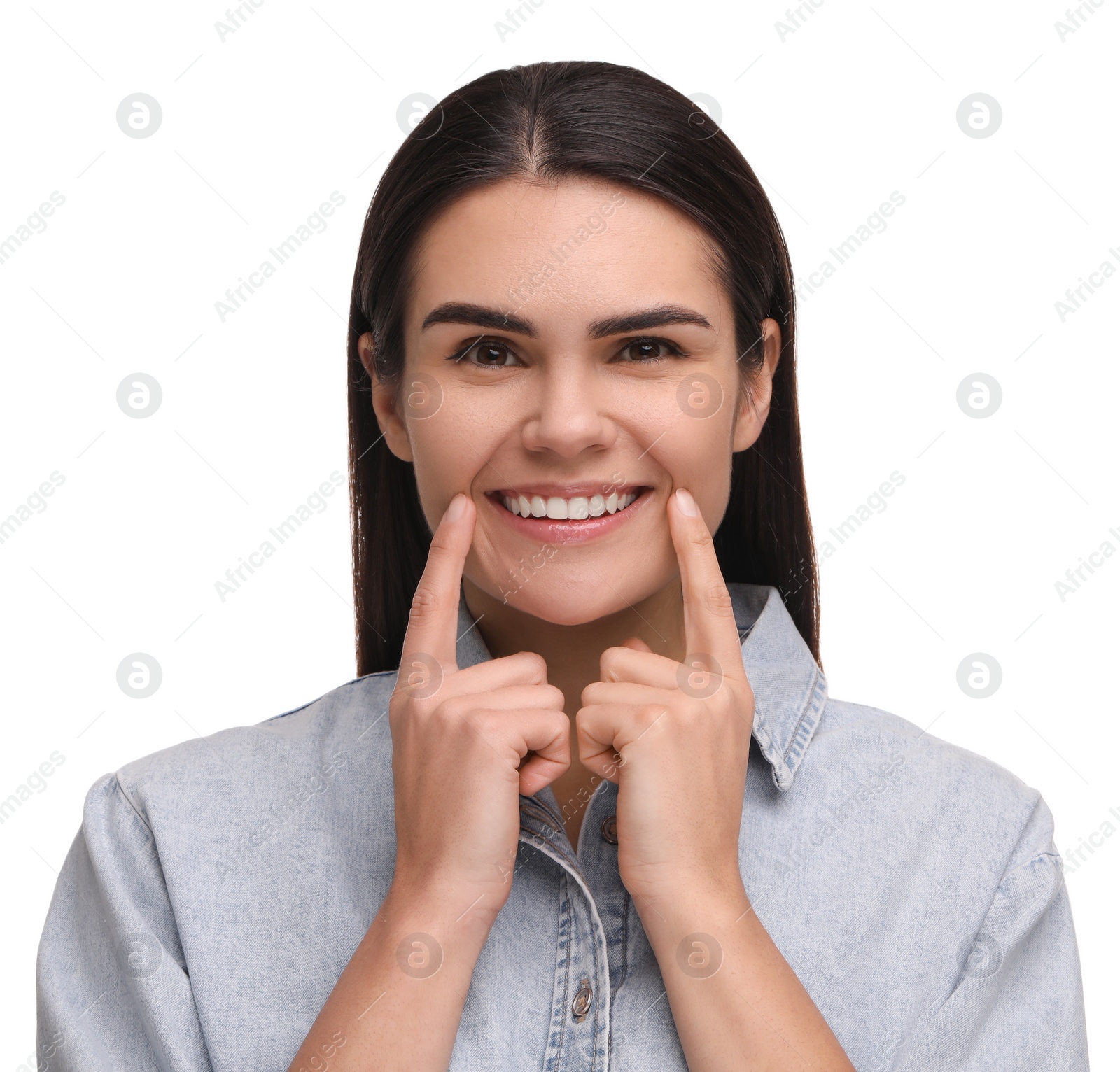 Photo of Young woman showing her clean teeth and smiling on white background