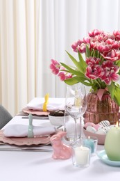 Photo of Festive table setting with beautiful flowers. Easter celebration