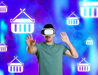 Virtual shopping. Man using VR headset on color background