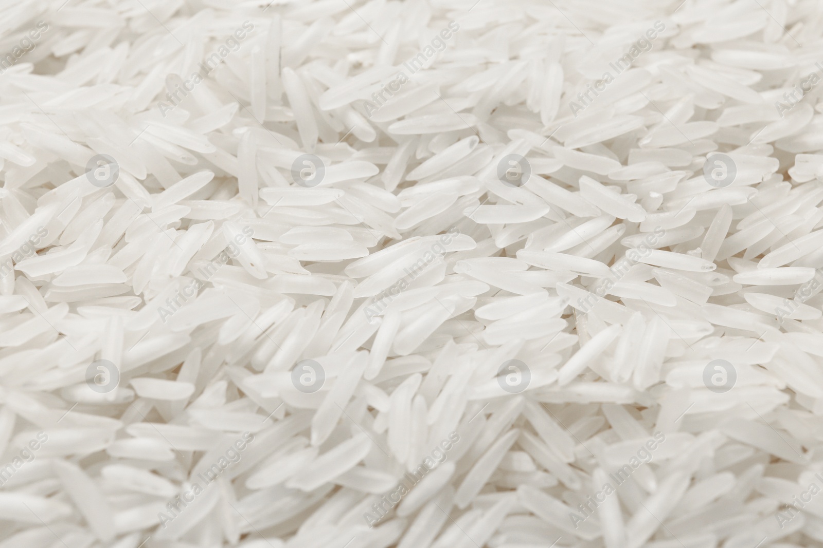 Photo of Raw basmati rice as background, closeup view