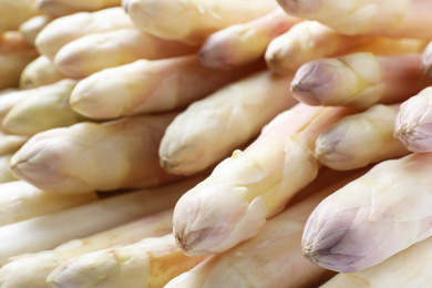 Photo of Fresh ripe white asparagus as background, closeup