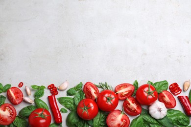 Photo of Flat lay composition with fresh basil leaves on light grey table. Space for text