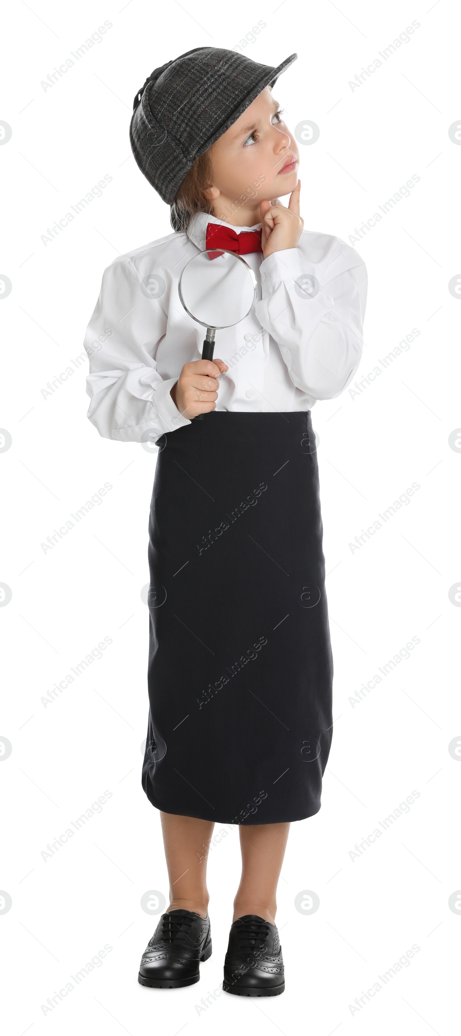 Photo of Cute little child in hat with magnifying glass playing detective on white background