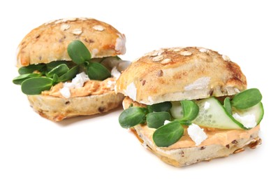 Photo of Delicious sandwiches with hummus, microgreens and cucumber slices isolated on white