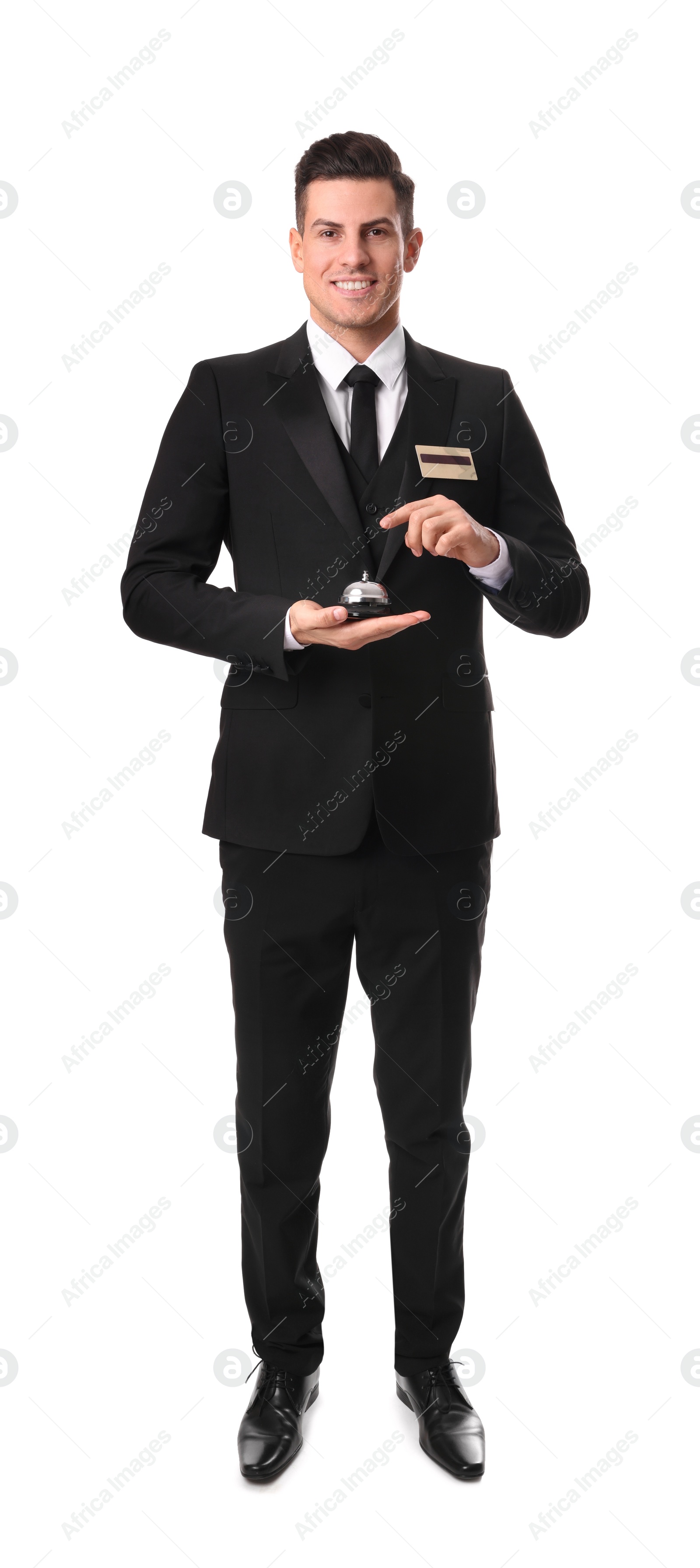 Photo of Happy receptionist in uniform holding service bell on white background