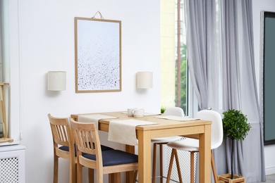 Modern room interior with wooden dining table