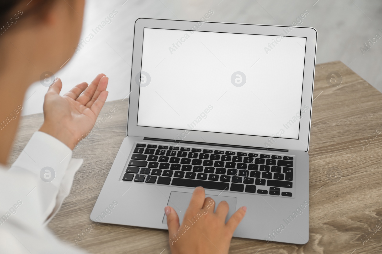 Photo of Coworkers working together online. Young woman using video chat on laptop, closeup