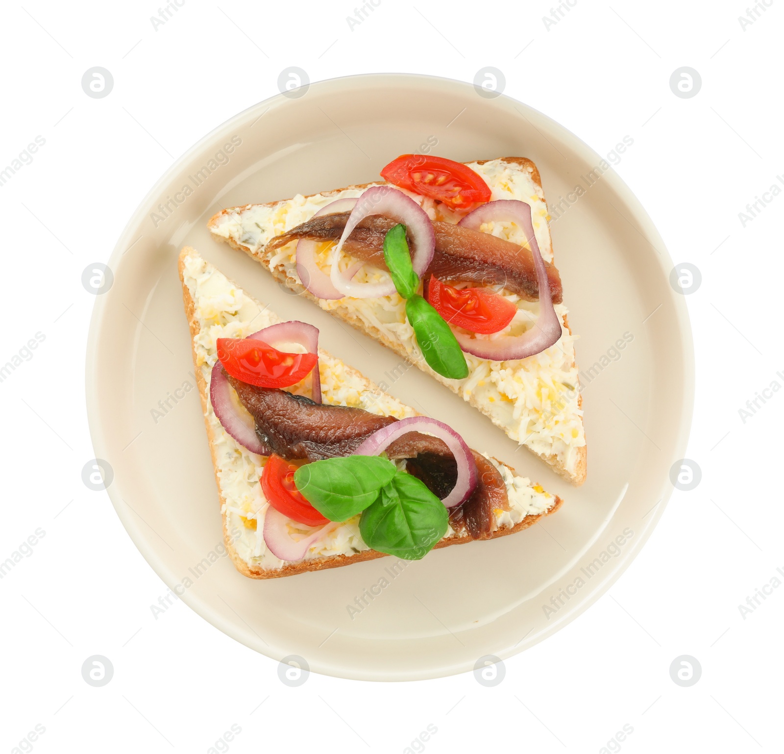 Photo of Delicious sandwiches with anchovy, tomato and basil on white background, top view