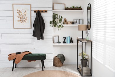 Photo of Hallway interior with console table and stylish decor