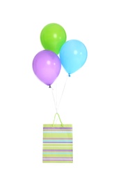 Photo of Paper bag with bright air balloons on white background