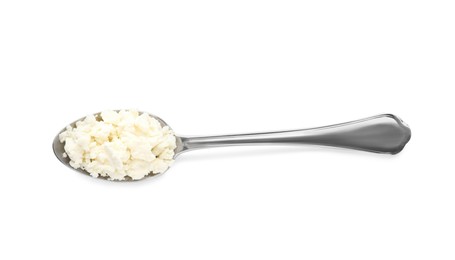 Photo of Delicious fresh cottage cheese in spoon isolated on white, top view