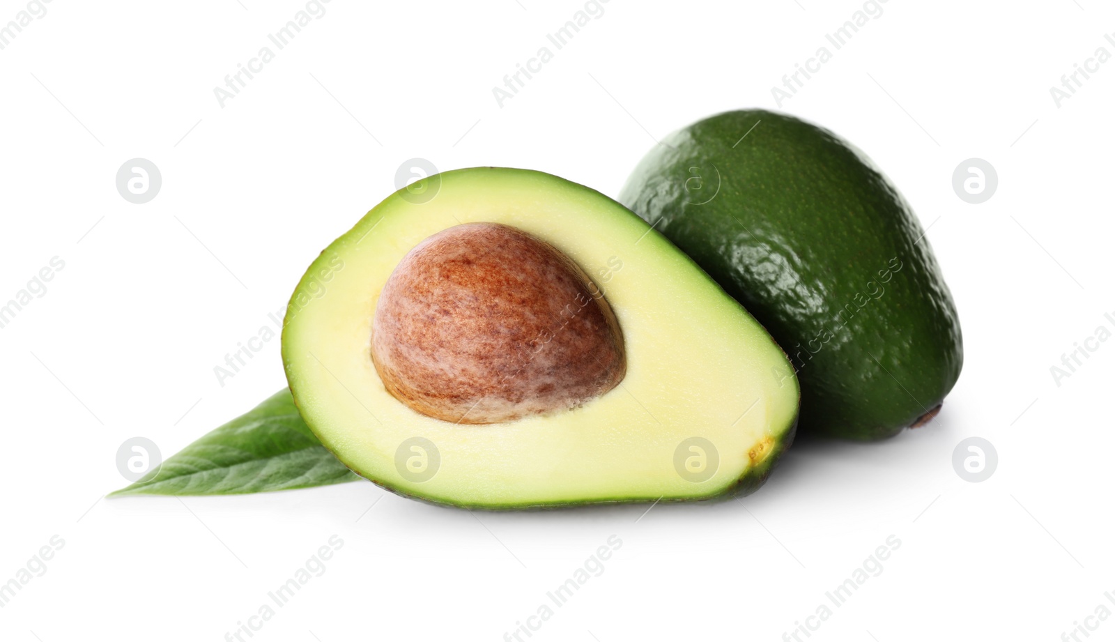 Photo of Whole and cut avocados isolated on white