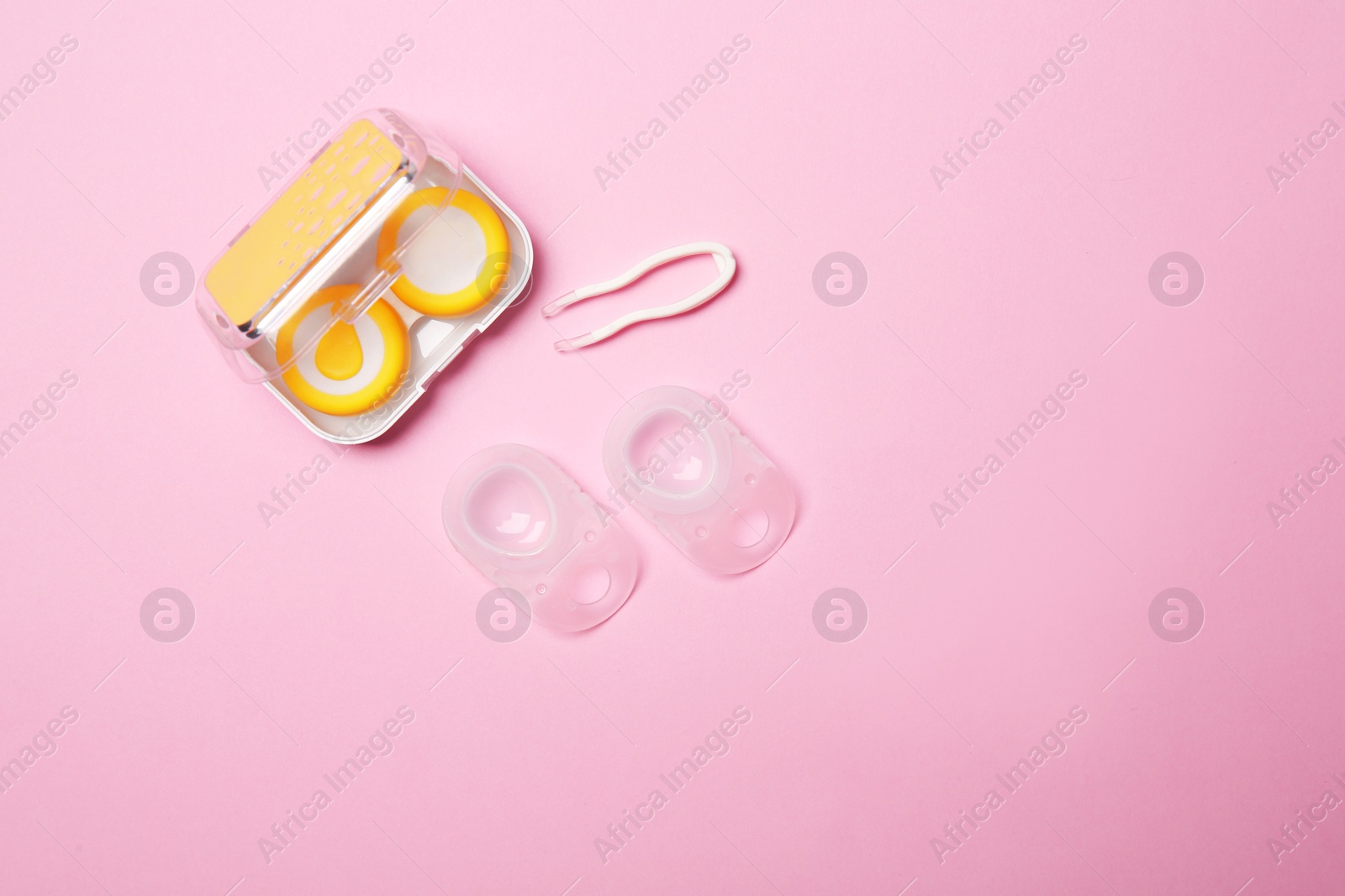 Photo of Flat lay composition with contact lenses and accessories on color background