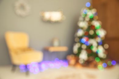 Photo of Blurred view of room with beautiful Christmas tree