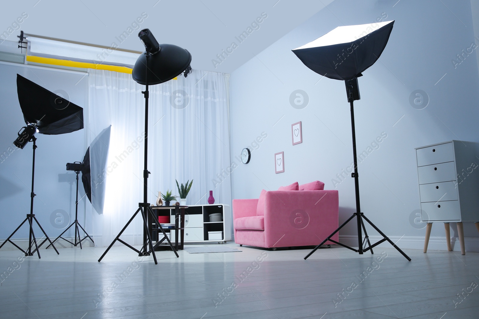 Photo of Example of living room interior design and professional equipment in photo studio