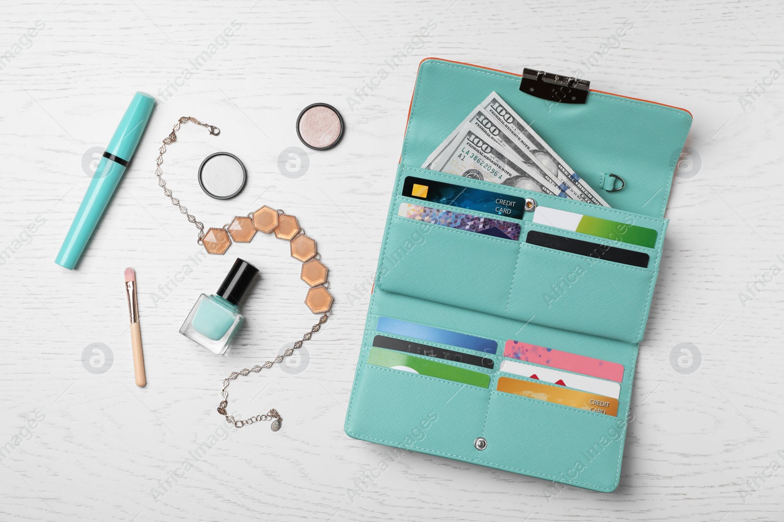 Photo of Flat lay composition with stylish wallet and accessories on light background