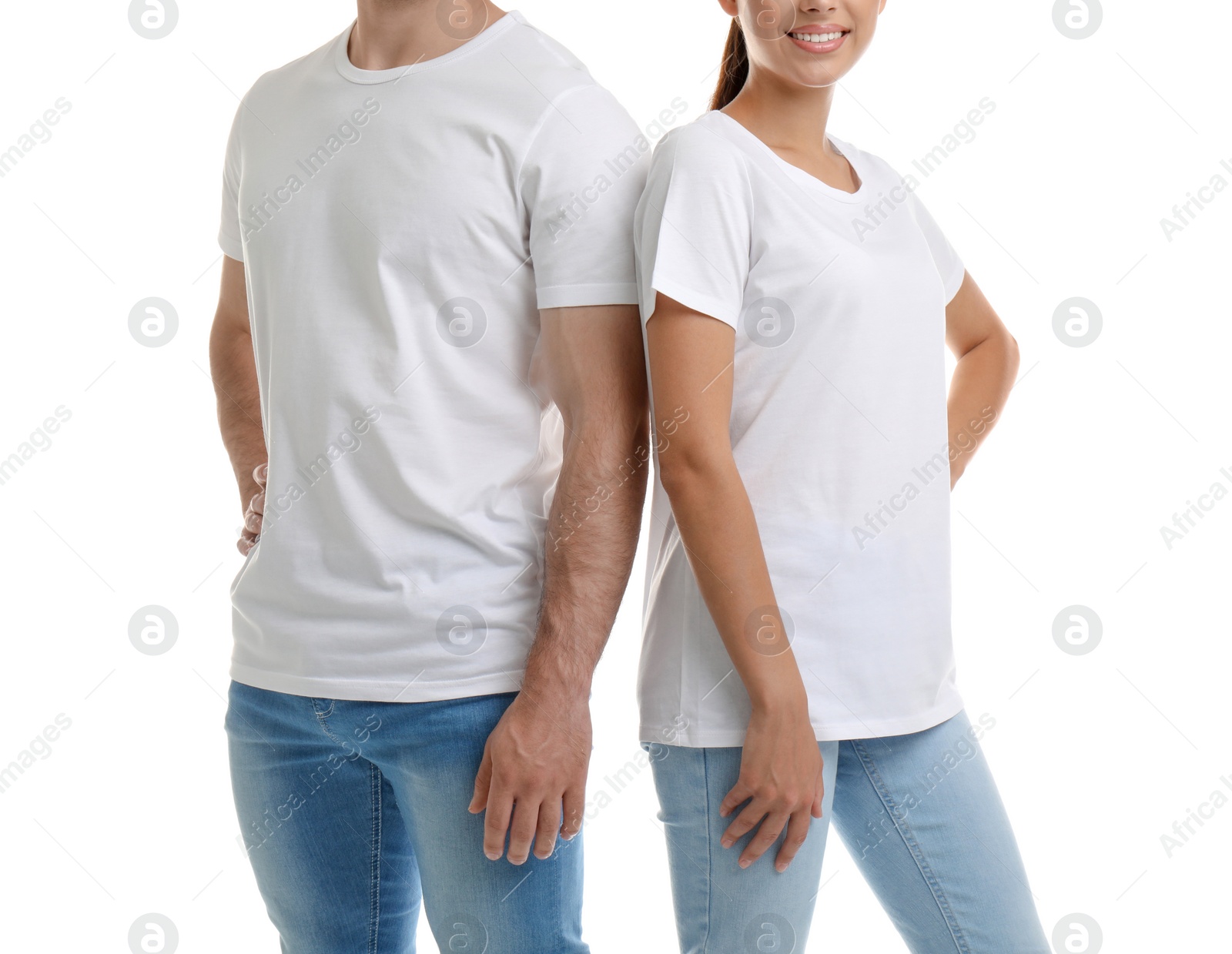 Photo of Young couple in t-shirts on white background. Mockup for design