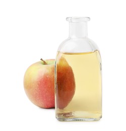 Photo of Apple vinegar in bottle and fruit isolated on white