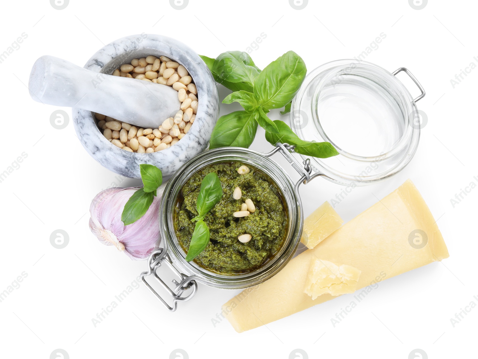 Photo of Fresh tasty pesto sauce and ingredients isolated on white, top view