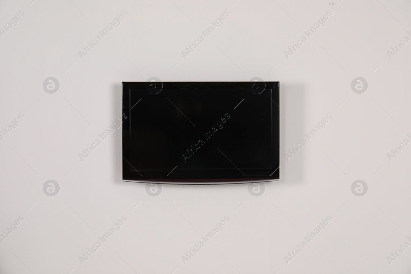 Photo of Modern flat screen TV on white background