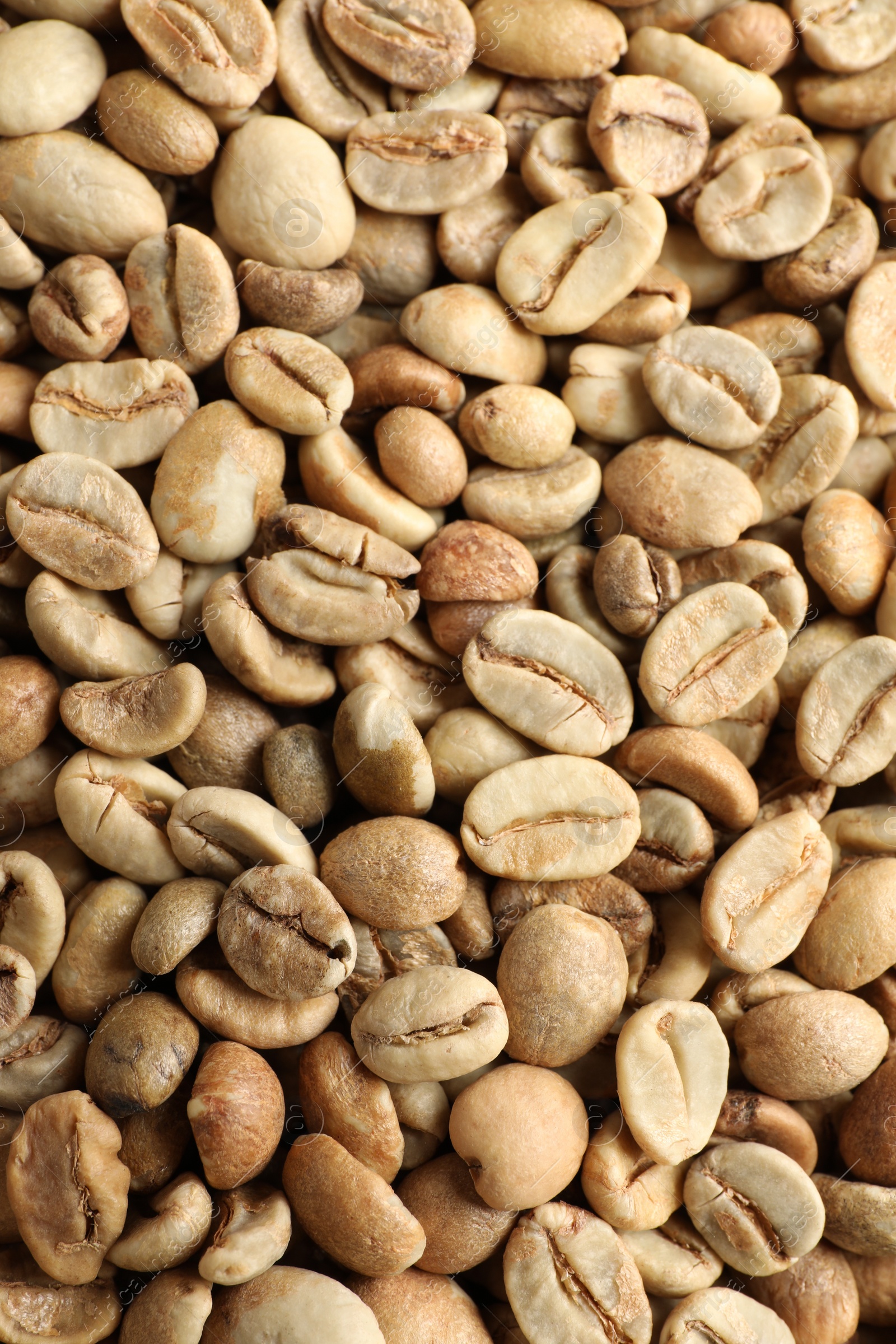 Photo of Many green coffee beans as background, top view