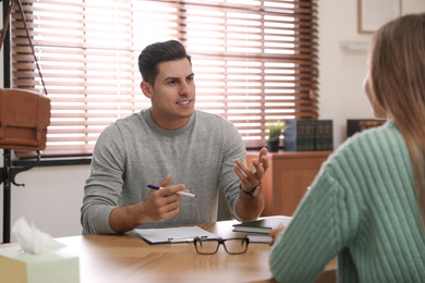 Professional psychotherapist working with patient in office