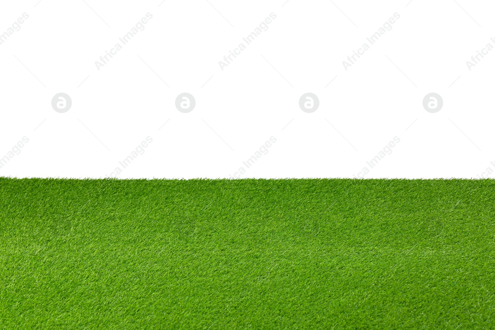 Photo of Green artificial grass surface isolated on white