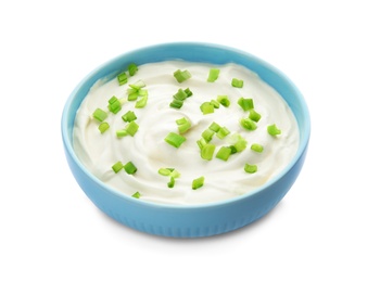 Bowl with sour cream and herbs on white background