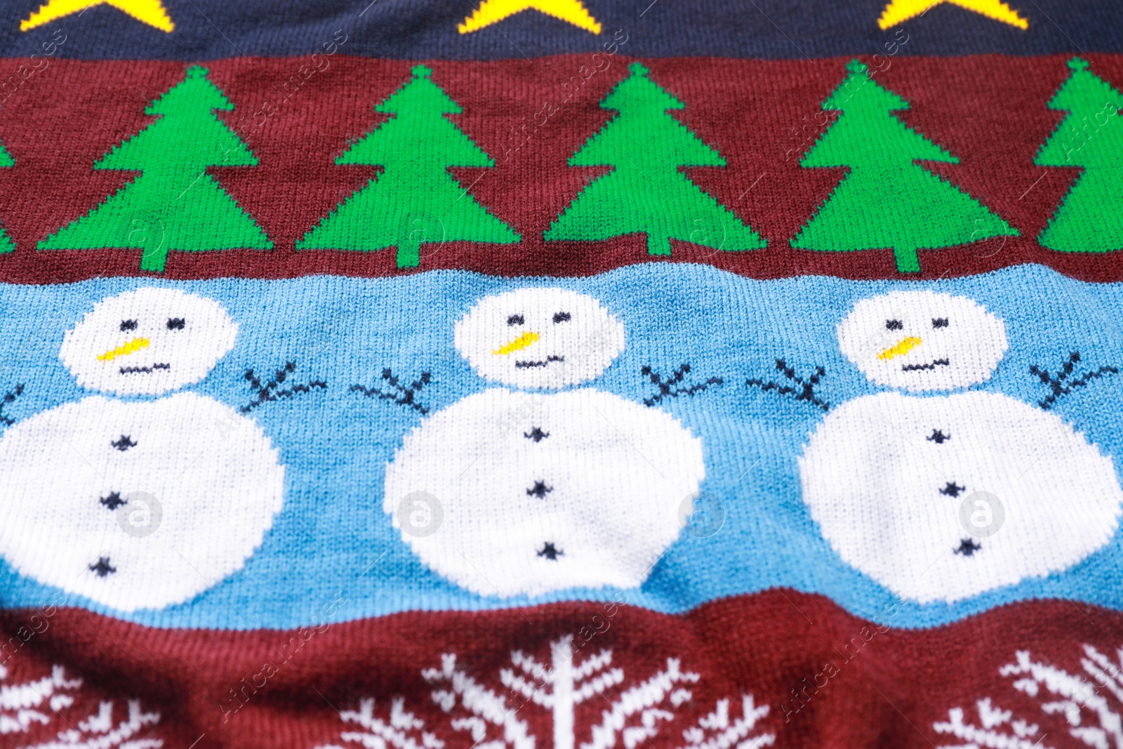 Photo of Warm Christmas sweater as background, closeup view